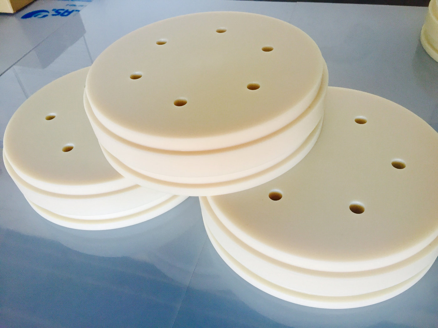 Machined nylon discs with drilled hole patterns
