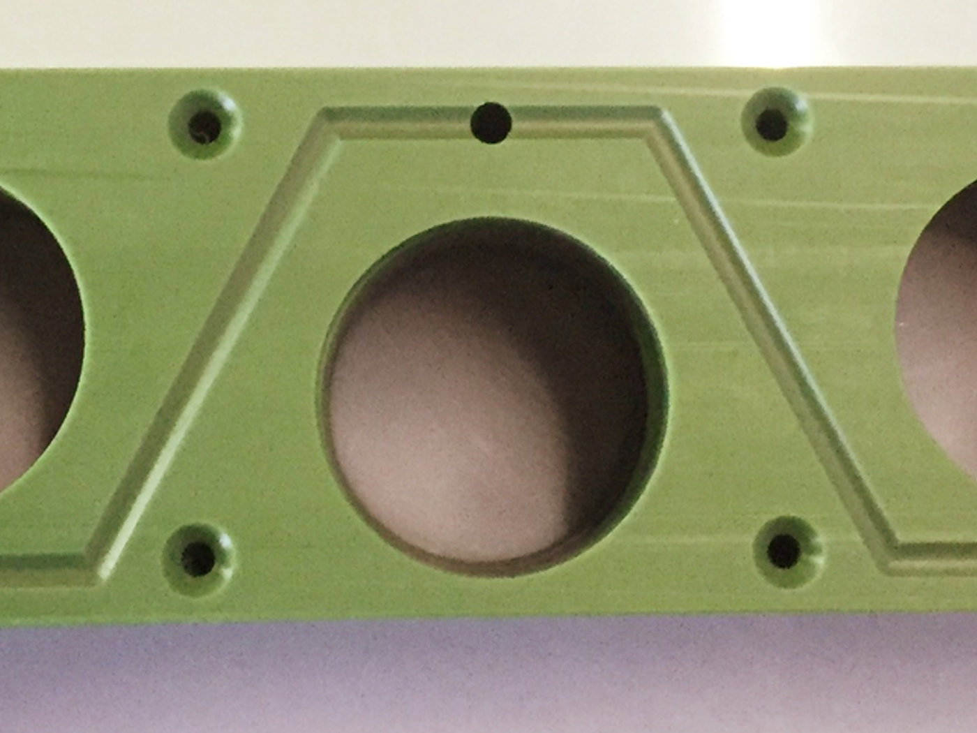 Machined plate with bored centre and mounting holes
