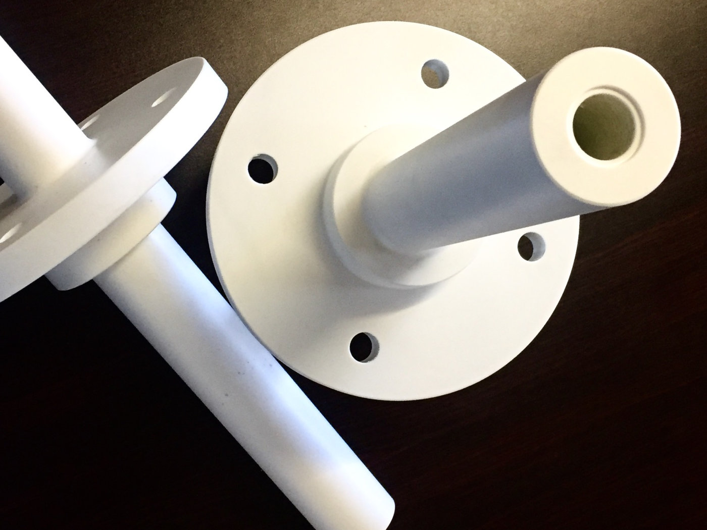 Machined plastic shaft, flanges and bushes