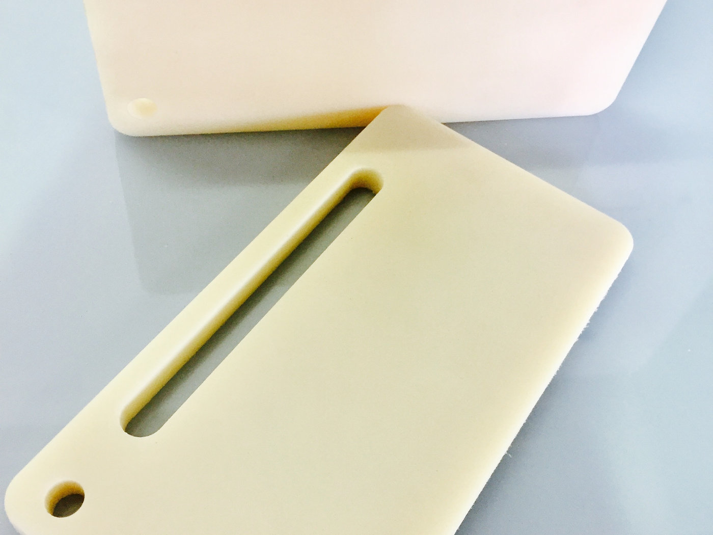 Machined nylon slide plate with slotted adjustment