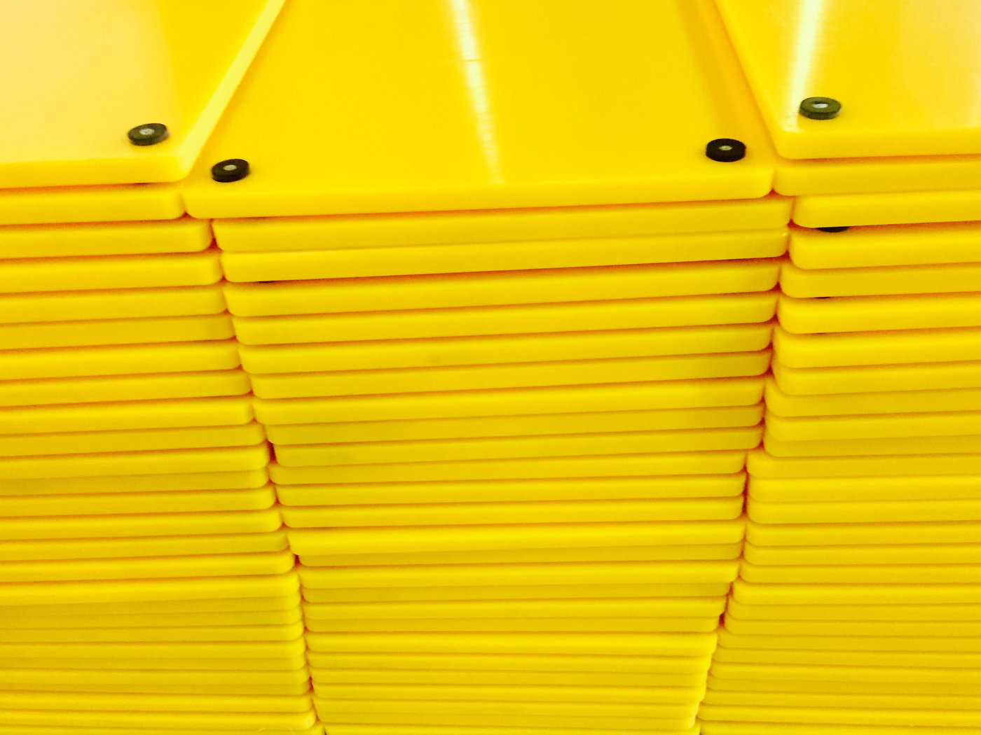 Polyethylene outrigger pads stacked for despatch